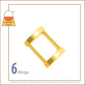 May include: Six gold metal D-rings. The rings are approximately 1 inch in diameter.