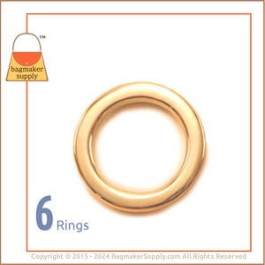 May include: A gold-colored metal ring, likely for bag making or crafts, is centered on a white background. The number "6" and the word "Rings" are displayed in the lower left corner. The logo for "bagmaker supply" is in the upper left corner.
