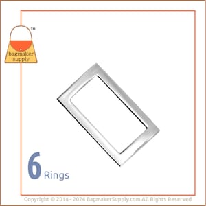 May include: Six silver metal rings, each with a rectangular shape. The rings are arranged in a row, with the text "6 Rings" below them.