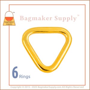 May include: Six gold triangle rings. The rings are about 1 inch in diameter.  The rings are a hardware supply for making bags.