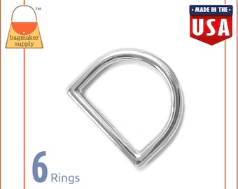 May include: Six silver D-rings, each measuring approximately 1 inch in diameter. The rings are made in the USA.  The image includes the text "6 Rings".