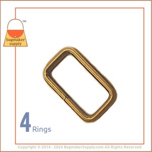 May include: Four gold-toned metal rings, each with a rectangular shape. The rings are arranged in a row, with the text "4 Rings" below them.