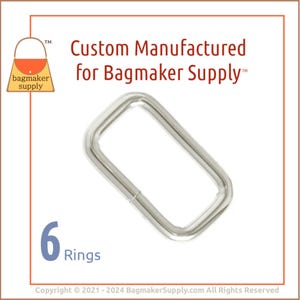May include: A shiny, silver-colored rectangular ring, likely for bagmaking. The image includes the text "Custom Manufactured for Bagmaker Supply" and "6 Rings". The logo of "bagmaker supply" is also visible.