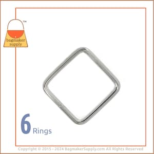 May include: Six silver square rings, each with a smooth, rounded edge. The rings are arranged in a row, with the text "6 Rings" below them.