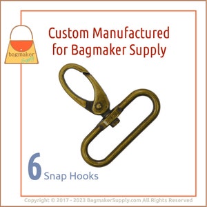May include: Six antique gold-toned snap hooks. The hooks are made of metal and have a spring-loaded clasp.  Custom manufactured for Bagmaker Supply.