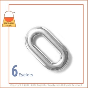 May include: Six silver oval eyelets, a type of metal hardware used for reinforcing holes in fabric and leather.