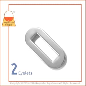 Puede incluir: Dos ojales de metal plateado, cada uno con una abertura rectangular. Los ojales están diseñados para usarse en artículos de cuero, como bolsos y carteras.