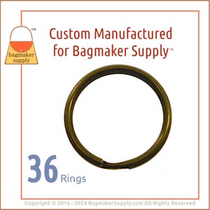 May include: A close-up of 36 gold-toned metal key rings. The rings are all the same size and are arranged in a pile. The text "36 Rings" is printed below the rings.