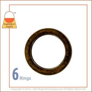 May include: Six antique gold metal rings. The rings are round and have a smooth finish.