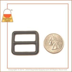 May include: A dark grey metal slider buckle with two rectangular openings, next to a US quarter coin. The buckle is likely for bag making or similar crafts. The logo for Bagmaker Supply is in the upper left corner.