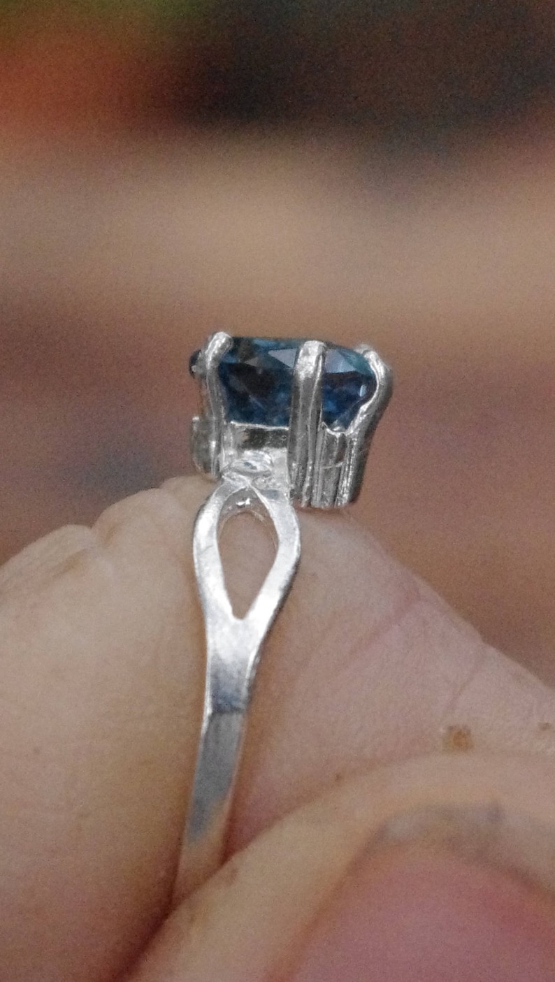 Natural London Blue Topaz Trillion in Sterling Silver Ring