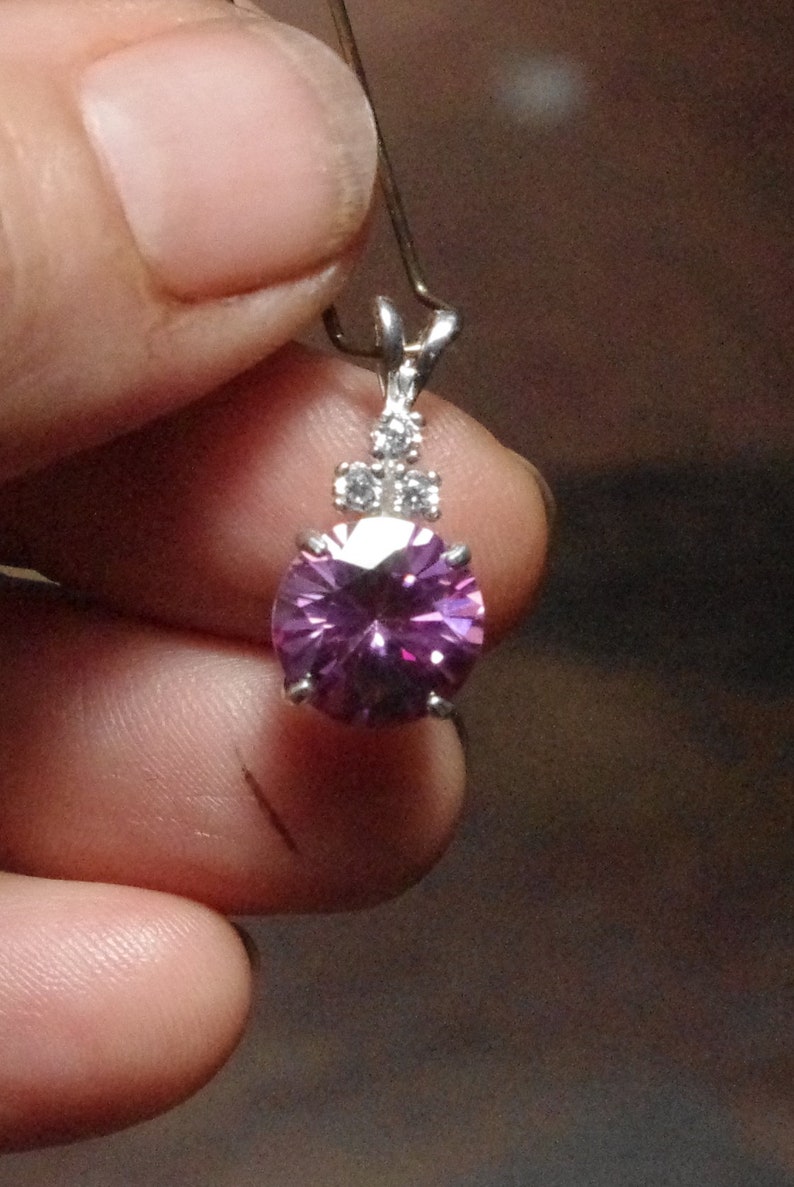 Lovely Pink Moissanite with Natural white zircon accents in Sterling Silver Pendant