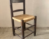 Primitive Spanish Rush Seat Chair, Carved Wood, with Straw Seat of the 20th Century, wooden wicker chairs