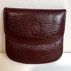 Cartera unisex vintage de cuero marrón, pequeña y ligera.