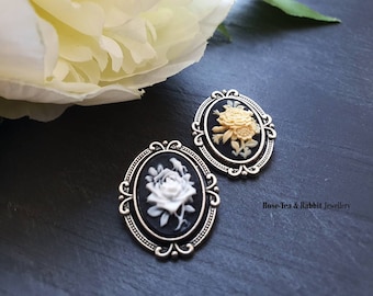 Faux cameo moulded plastic brooch white flower on orange