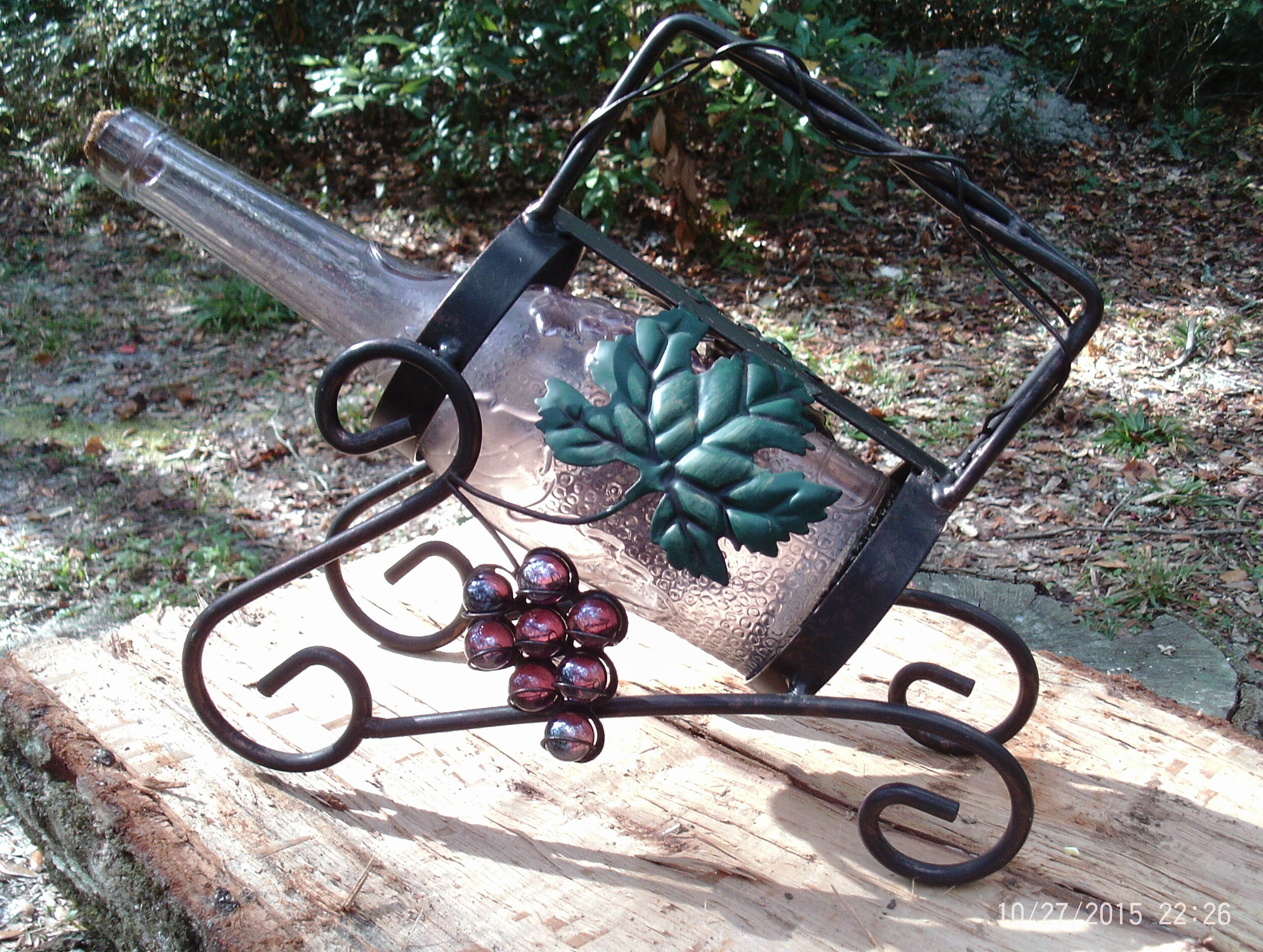 Wrought iron bottle holder sales