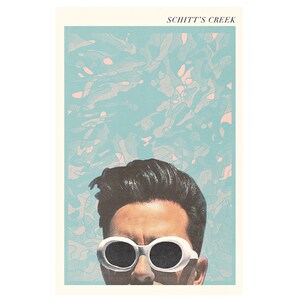 May include: A poster featuring a stylized image of a person wearing white sunglasses, with the text "SCHITT'S CREEK" at the top. The background has a blue and pink abstract design.