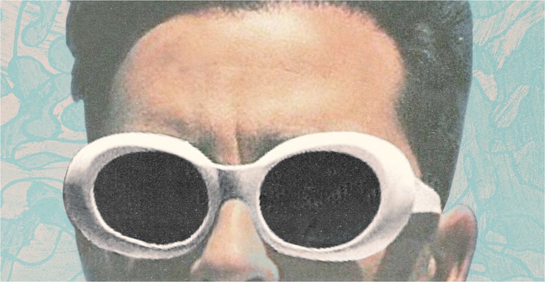 May include: Close-up of a person wearing white-framed sunglasses with large, oval black lenses. The image has a vintage, slightly faded aesthetic, with a light blue floral pattern in the background.