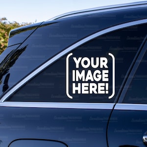May include: A black car with a white sticker that says "YOUR IMAGE HERE!" on the back window.