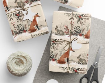 May include: Gift-wrapped presents with a winter forest scene featuring foxes and rabbits. The gifts are tied with twine and adorned with white heart-shaped tags. A ball of twine, scissors, and additional tags are also present.