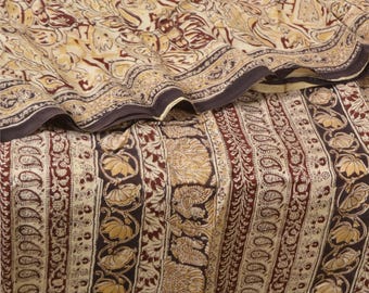 May include: A textile fabric featuring a cream background with dark brown and tan printed patterns. The design includes vertical stripes of paisley motifs, floral elements, and stylized bird figures, with a folded section showing the drape.