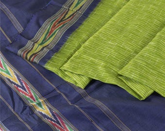 May include: A folded textile featuring a vibrant color palette. The design includes sections of deep blue fabric with striped patterns and colorful borders. Adjacent to the blue is a section of bright green fabric with a subtle striped texture.