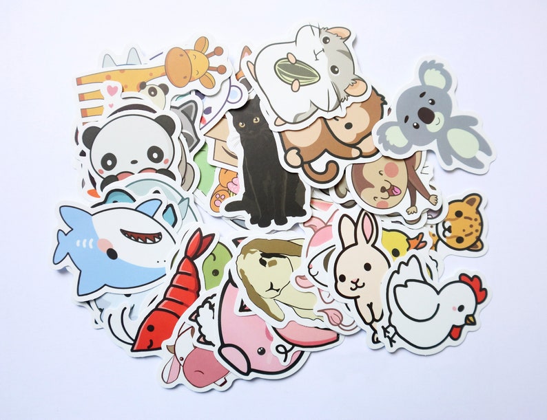 May include: A collection of colorful cartoon animal stickers featuring a variety of animals including a shark, a chicken, a rabbit, a koala, a monkey, a cat, a panda, a giraffe, a shrimp, a fish, and a hamster.
