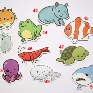 May include: A set of 10 colorful cartoon animal stickers. The stickers feature a pufferfish, frog, hippopotamus, clownfish, shark, shrimp, turtle, octopus, beluga whale, and a shark. The stickers are numbered 41 through 50.