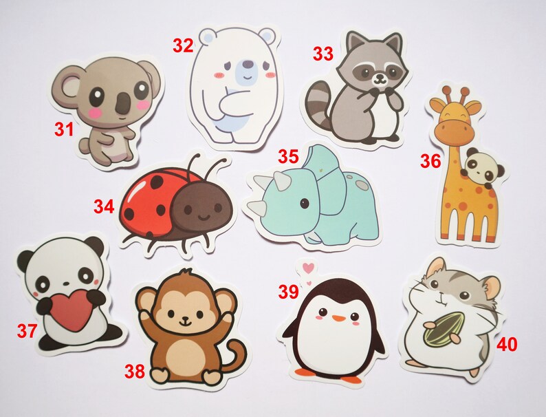 May include: A set of ten cute animal stickers, including a koala, polar bear, raccoon, giraffe, triceratops, ladybug, panda, monkey, penguin, and hamster. The stickers are all in cartoon style and have a white background.