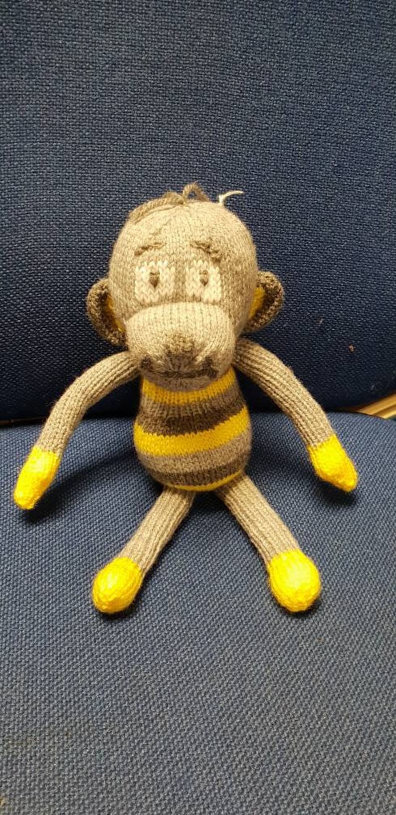 Hand knitted cheeky monkey cuddly toy