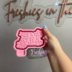 May include: Pink silicone mold for resin crafts. The mold is shaped like a speech bubble with the text "She's in her 20s but so is her anxiety".