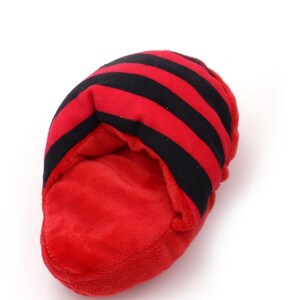 May include: Red and black striped plush toy shaped like a slipper.