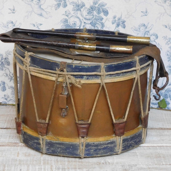 Large antique Couesnon Paris snare drum with original wood and brass drum sticks and leather holder,  Old French military drum