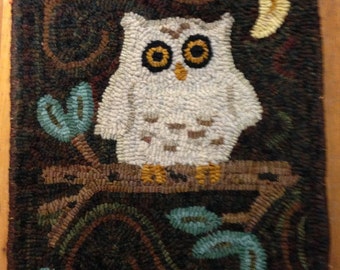 May include: A white owl with yellow eyes perched on a branch with brown leaves. The owl is surrounded by a dark green and brown background with a crescent moon in the upper right corner.