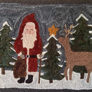May include: A red and white Santa Claus with a white beard and a brown bag in his hand stands in a snowy forest with a brown reindeer and a green Christmas tree.