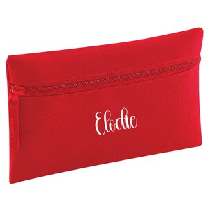 Personalised classic red pencil case with zip closure, customised with a child's name in white vinyl. Durable 600D polyester school pencil case for pens, pencils and stationery, ideal for school, nursery and back to school essentials.