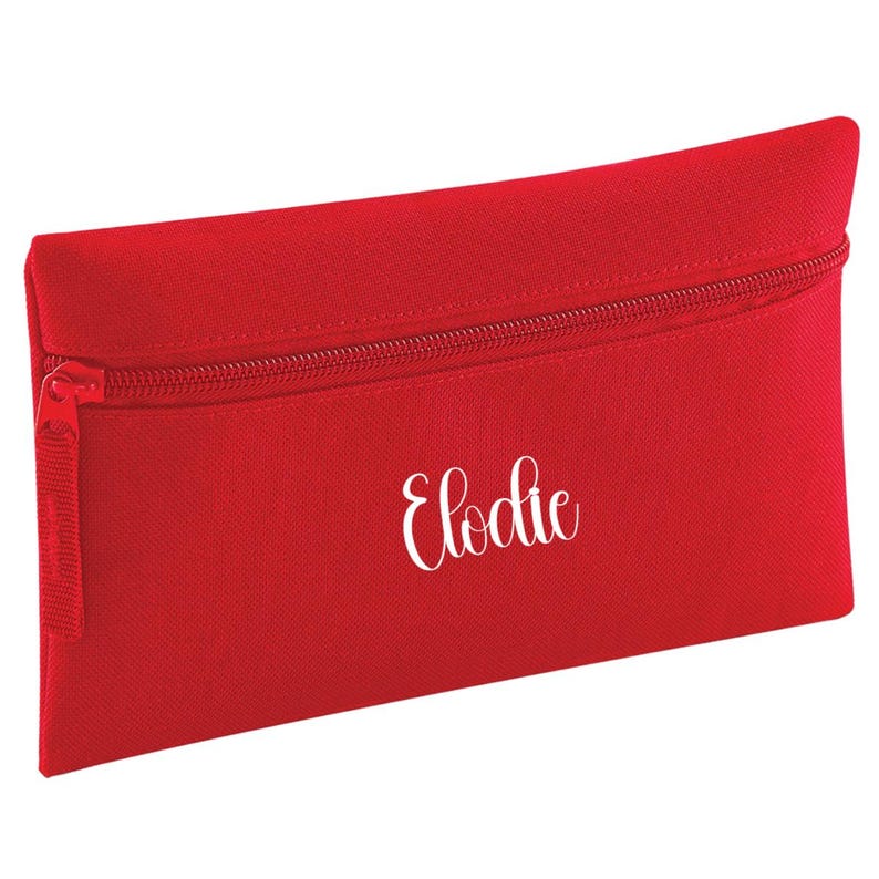 Personalised classic red pencil case with zip closure, customised with a child's name in white vinyl. Durable 600D polyester school pencil case for pens, pencils and stationery, ideal for school, nursery and back to school essentials.