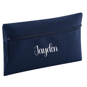 Personalised French navy blue pencil case with zip closure, customised with a child's name in white vinyl. Durable 600D polyester school pencil case for pens, pencils and stationery, ideal for school, nursery and back to school essentials.