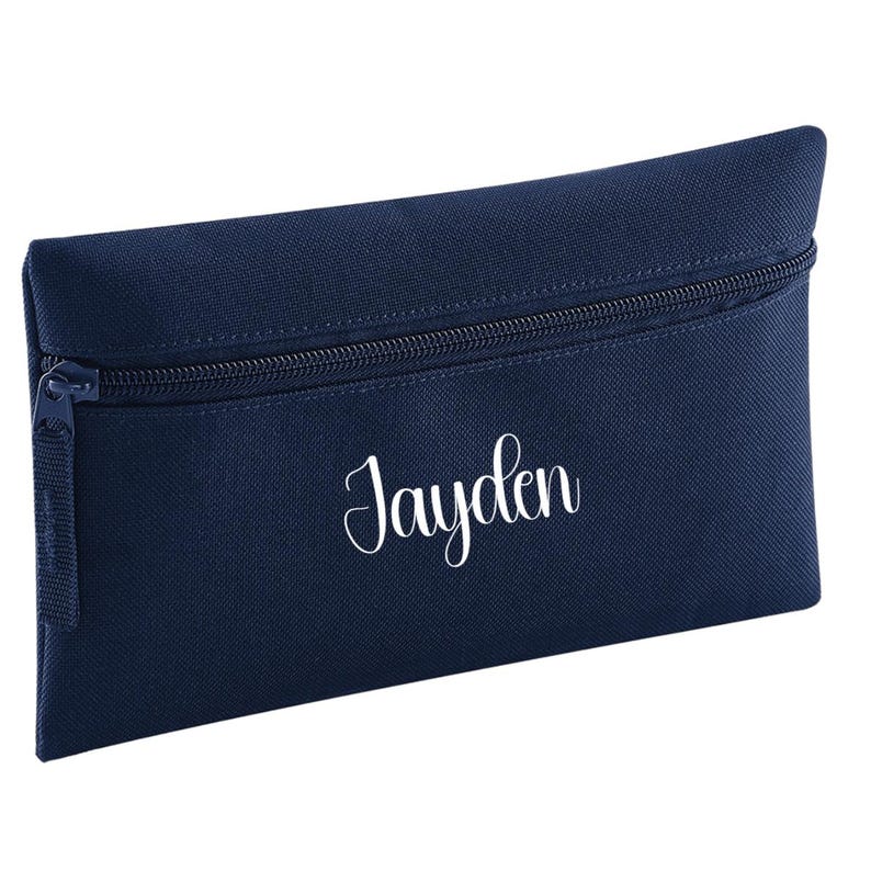 Personalised French navy blue pencil case with zip closure, customised with a child's name in white vinyl. Durable 600D polyester school pencil case for pens, pencils and stationery, ideal for school, nursery and back to school essentials.
