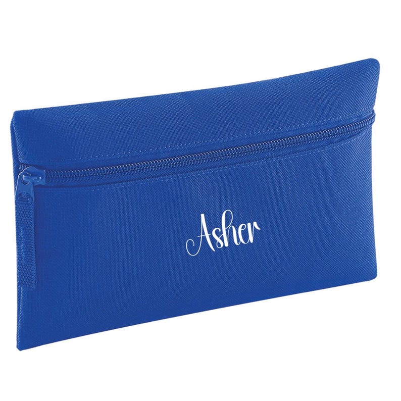 Personalised bright royal blue pencil case with zip closure, customised with a child's name in white vinyl. Durable 600D polyester school pencil case for pens, pencils and stationery, ideal for school, nursery and back to school essentials.