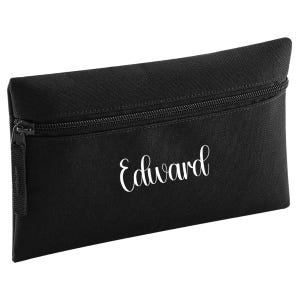 Personalised black pencil case with zip closure, customised with a child's name in white vinyl. Durable 600D polyester school pencil case for pens, pencils and stationery, ideal for school, nursery and back to school essentials.