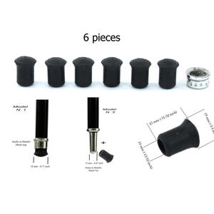 Può includere: Sei punte per bastone in gomma nera, ciascuna con un diametro di 25 mm. Le punte sono progettate per adattarsi alla parte inferiore di un bastone per fornire presa e stabilità. L'immagine mostra anche una punta per bastone in metallo con un anello argentato.