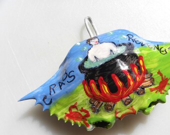 This is the "Crabs Revenge" man being steamed by crabs handpainted on a Maryland crab shell ornament