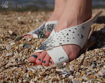 Handpainted cross strapped flat genuine leather sandals. Buckle ankle closure. Leather insole, rubber sole. Follow your dreams.
