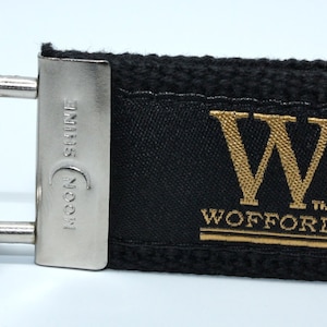 May include: Black canvas keychain with a gold metal W and the word "Wofford" in gold lettering.