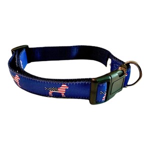 May include: A blue dog collar with a repeating pattern of white silhouettes of dogs with American flag designs. The collar has a black plastic buckle and a silver metal D-ring.