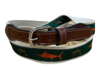Guy Harvey Spirit Line Green/ Orange ribbon on cotton webbing with leather belt ends. Comes with a Free Keychain