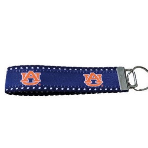 Auburn University Wrislet keychain with polka dot web. Licensed Auburn key chain