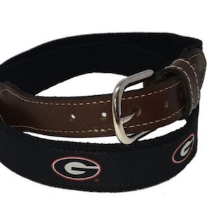 University of Georgia UGA ribbon belt with cotton Web with Leather Belt ends. A Georgia bulldogs belt licensed product.