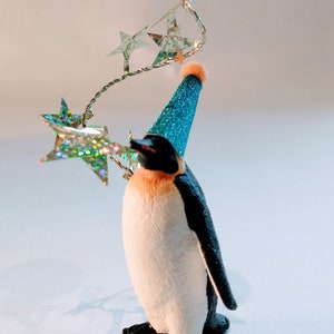 Cake Topper penguin,  add your own accessories, comes with a mini flag with wording of your choice.